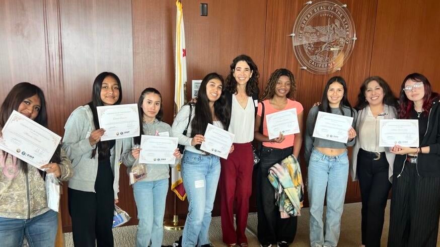 judge with students at event