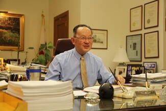justice chin at desk in chambers