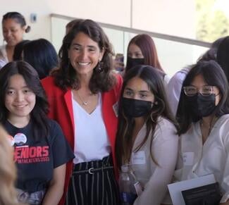 Judge Julia Alloggiamento poses with students attending the Superior Court of Santa Clara County's Young Women’s Power Lunch