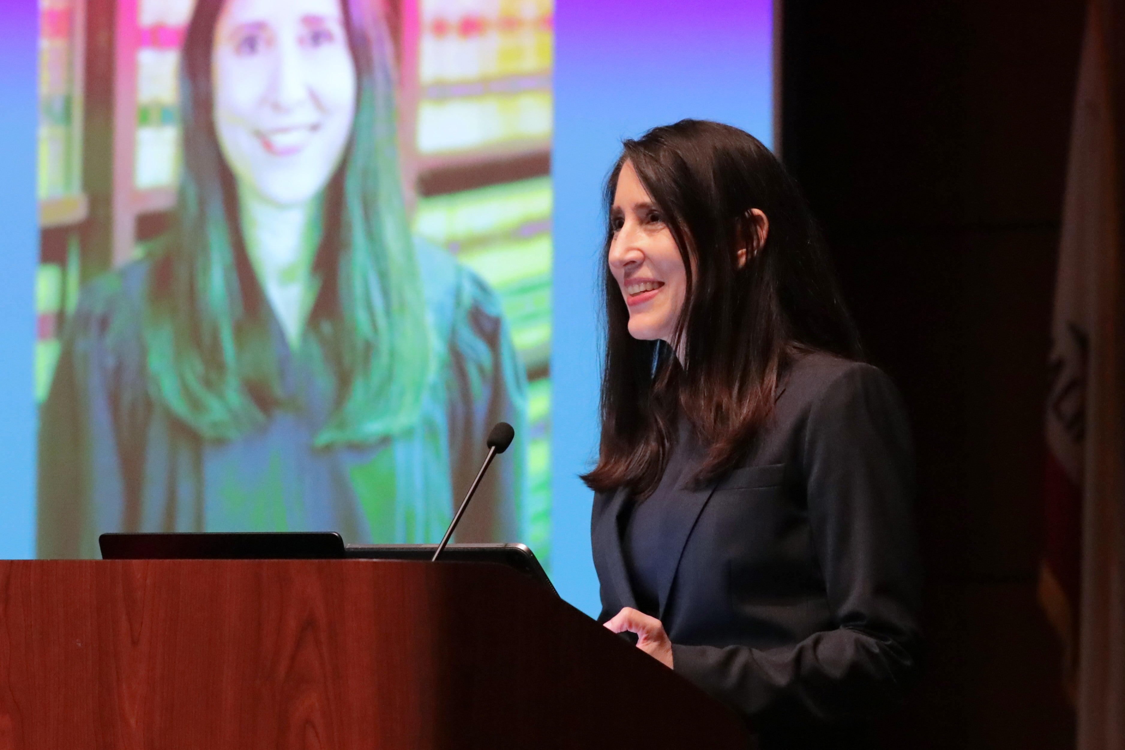Chief Justice Patricia Guerrero stands at a podium addressing audience.