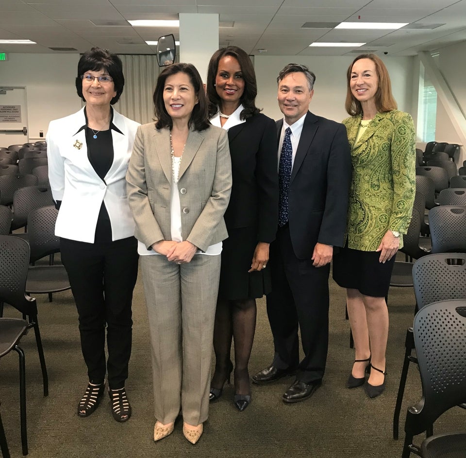 Administrative Director Martin Hoshino joins the Chief Justice on her tour of the Monterey court and meeting with Monterey County judges from the Salinas courthouse. L to R: Presiding Judge Lydia Villarreal, Chief Justice Tani G. Cantil-Sakauye, Judge Marla Anderson, Administrative Director Martin Hoshino, and Assistant Presiding Judge Julie Culver. Court and branch leaders standing in pose in the juror orientation room