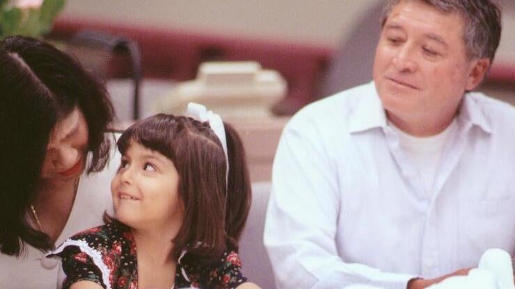 Parents sitting with child in courtroom during Adoption Day event in Superior Court of Los Angeles County