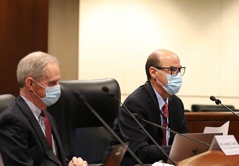 Judge Jonathan Conklin (left) and Judge David Rubin presenting budget proposals in the Judicial Council boardroom 