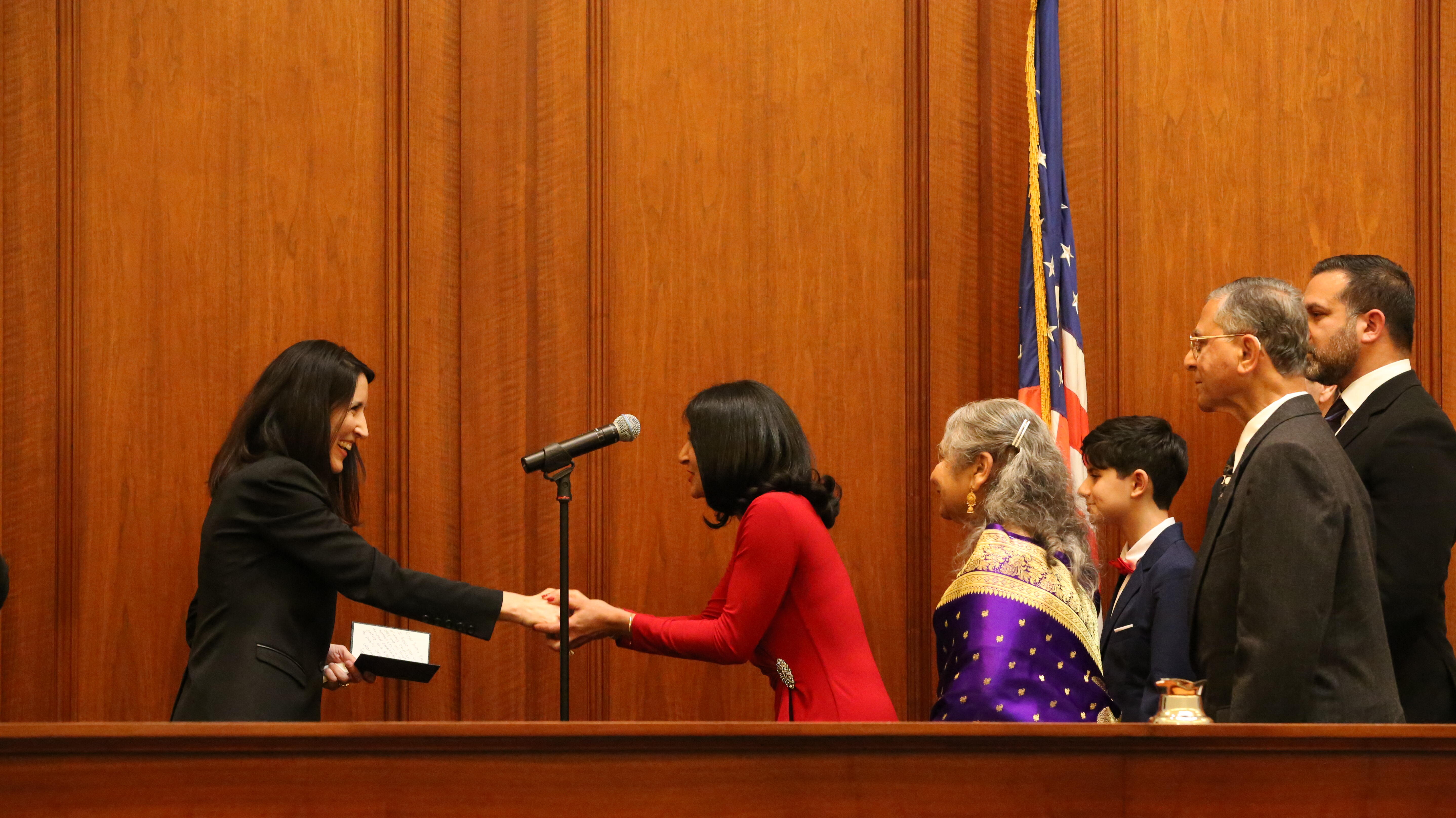 Chief Justice Guerrero shaking hands with Justice Mesiwala during COJA