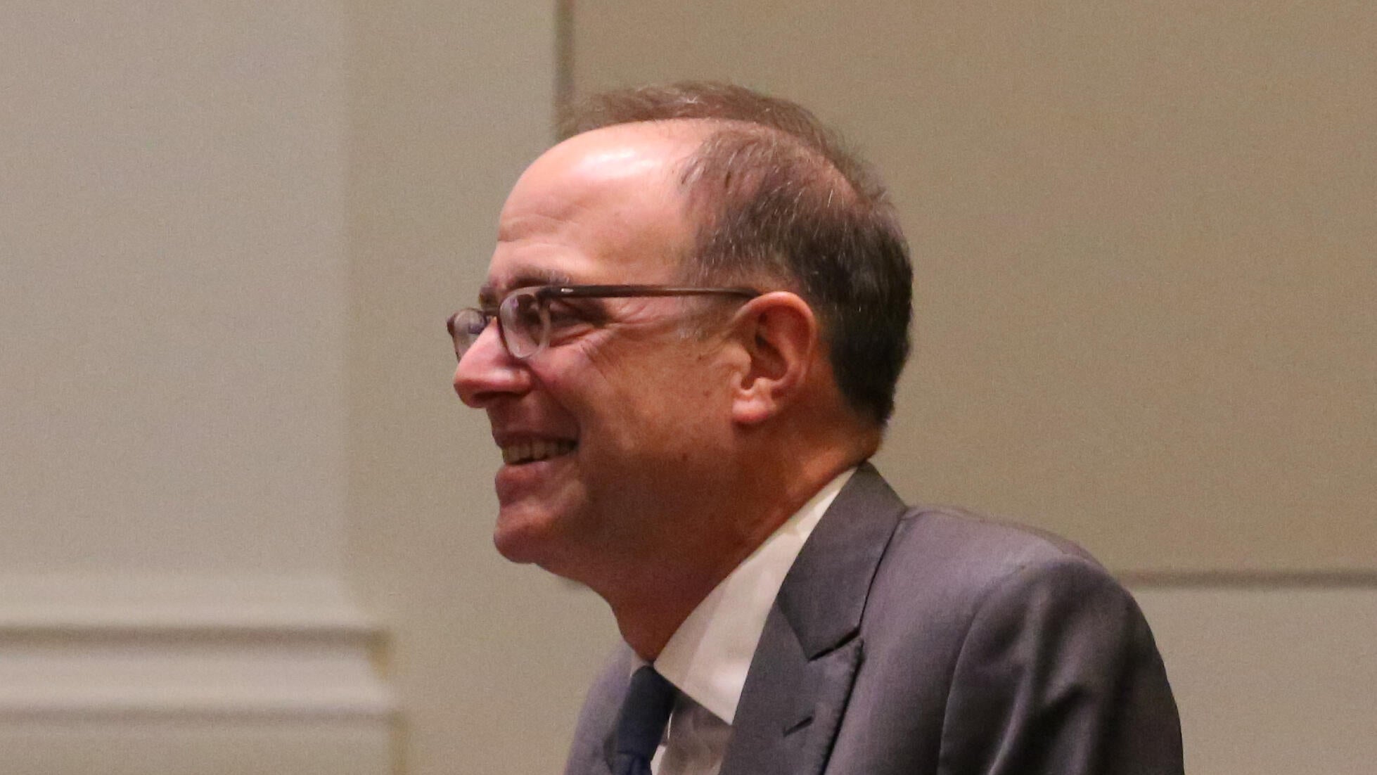 Justice Daniel Bromberg in formal attire at COJA hearing