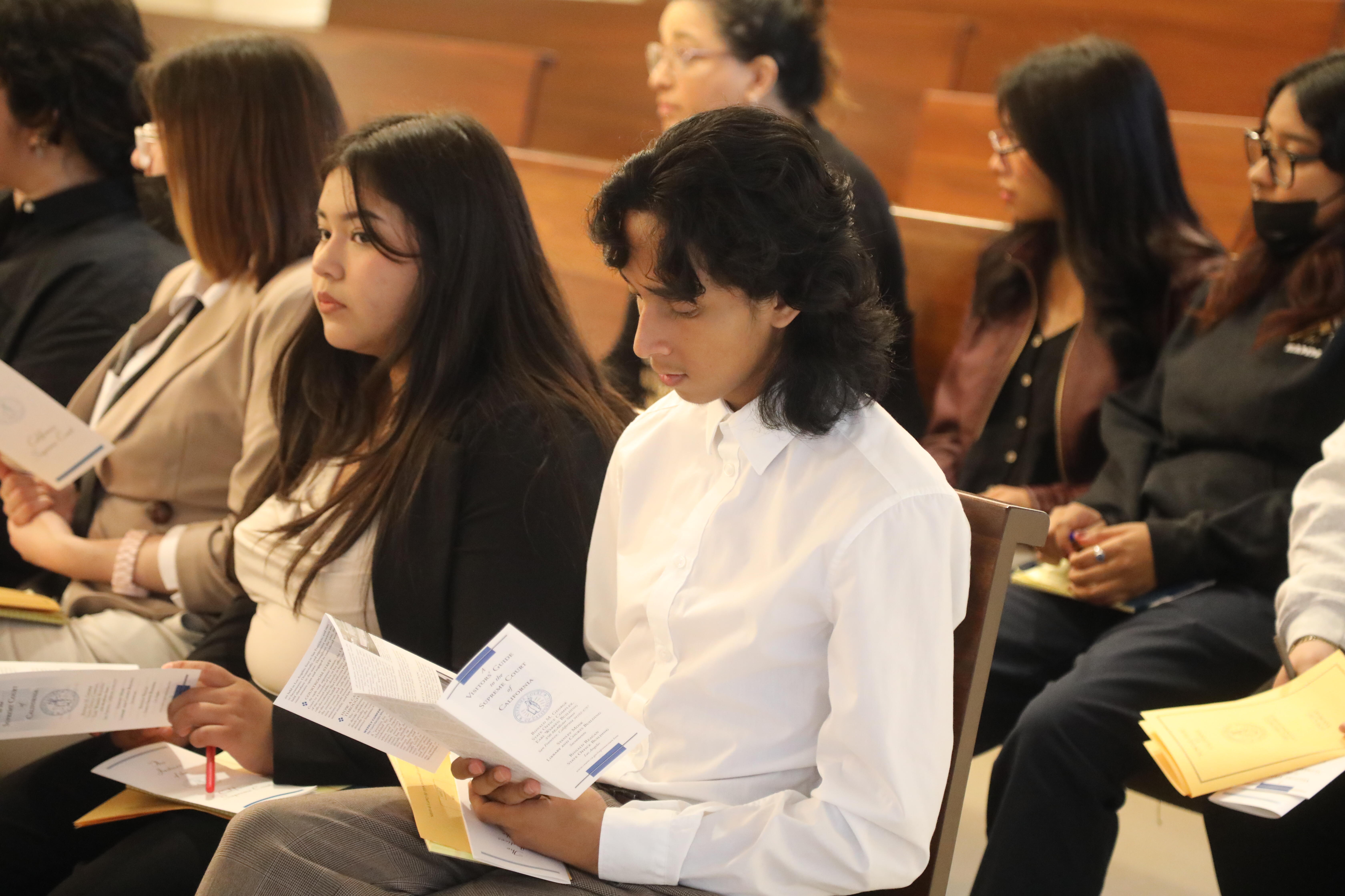 student reading argument details