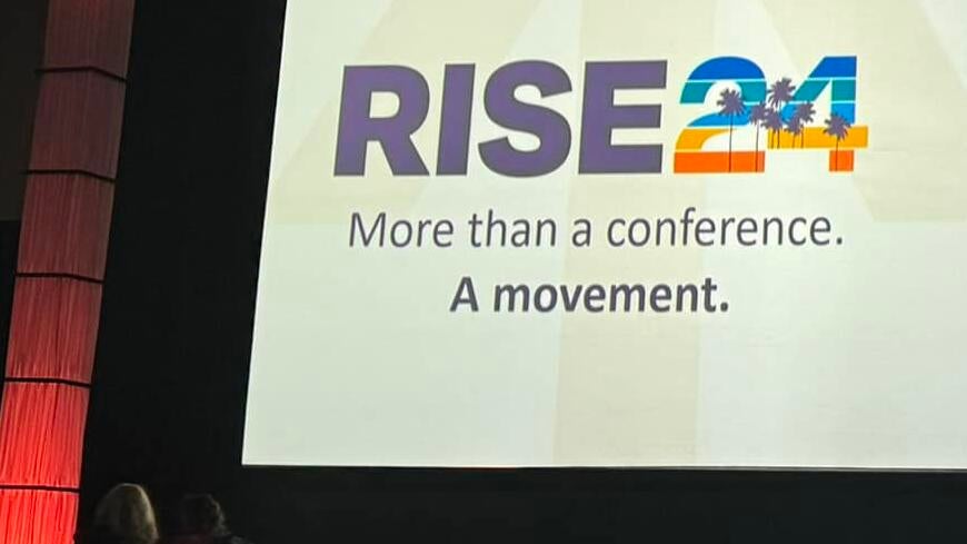more than a conference, a movement banner on stage