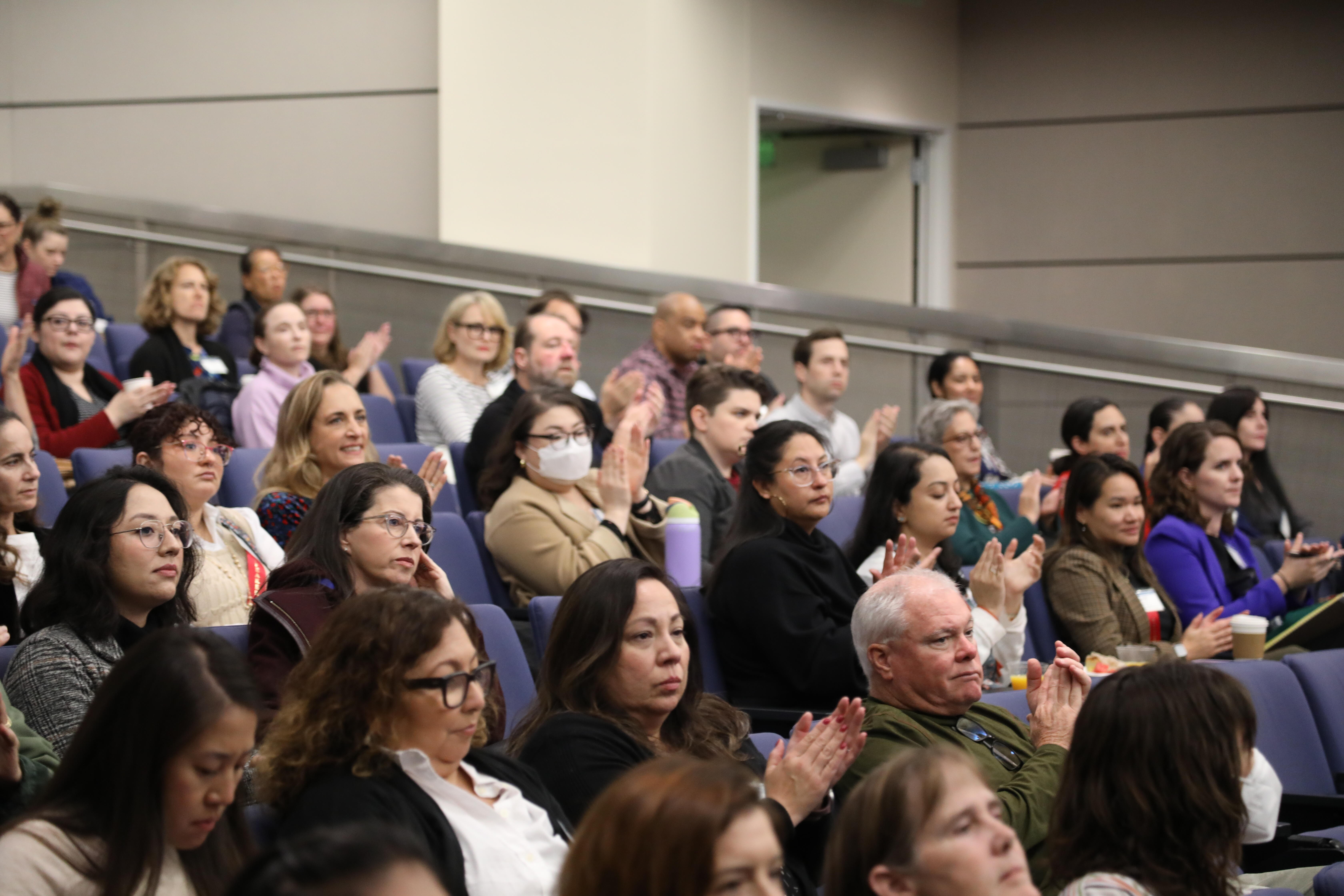 people sitting in an auditorium