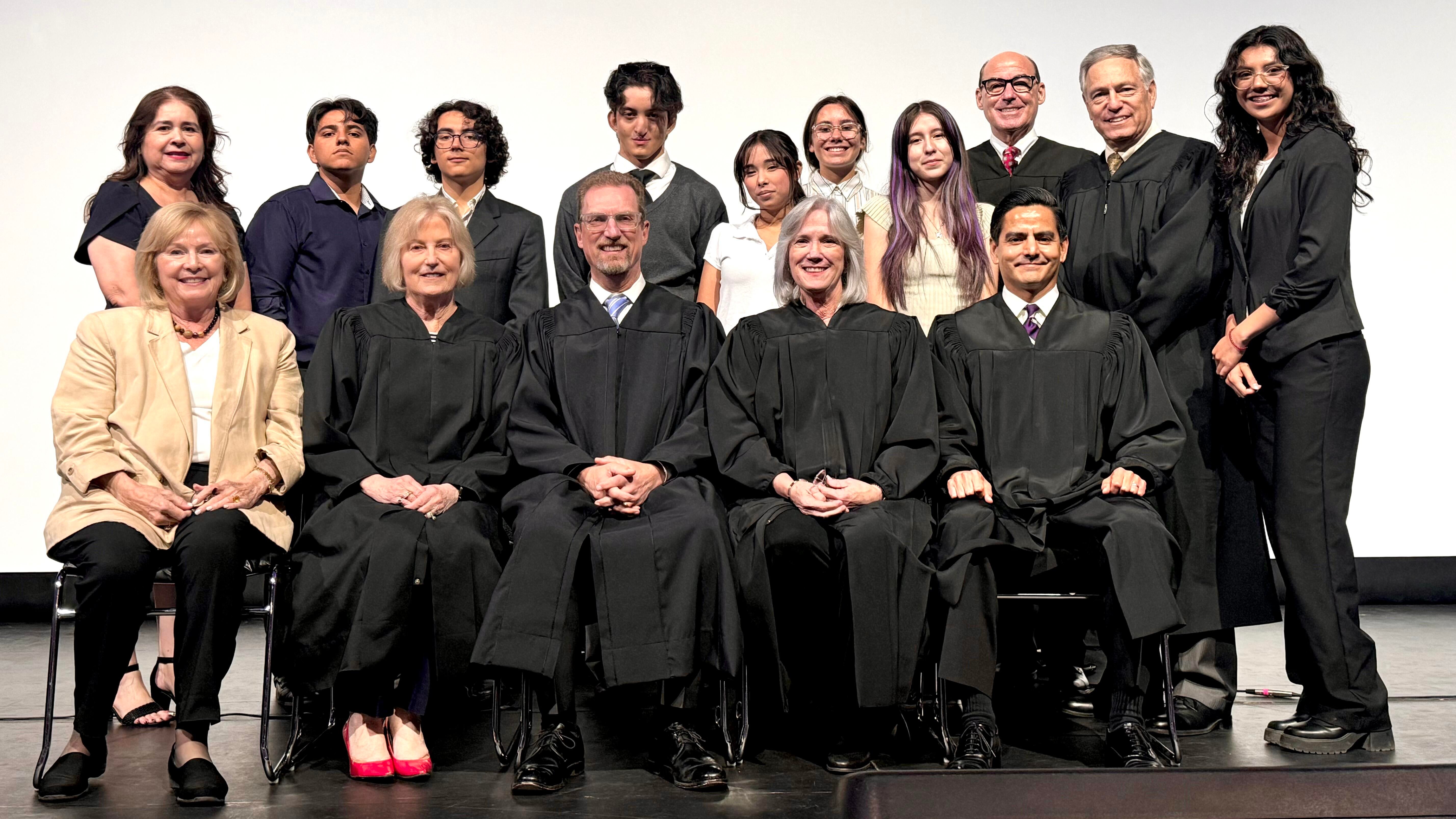 Members of the Fourth District Court of Appeal in the front row with students and staff in the back row.