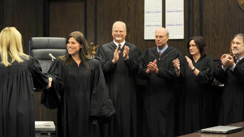 Judges clapping and shaking hands