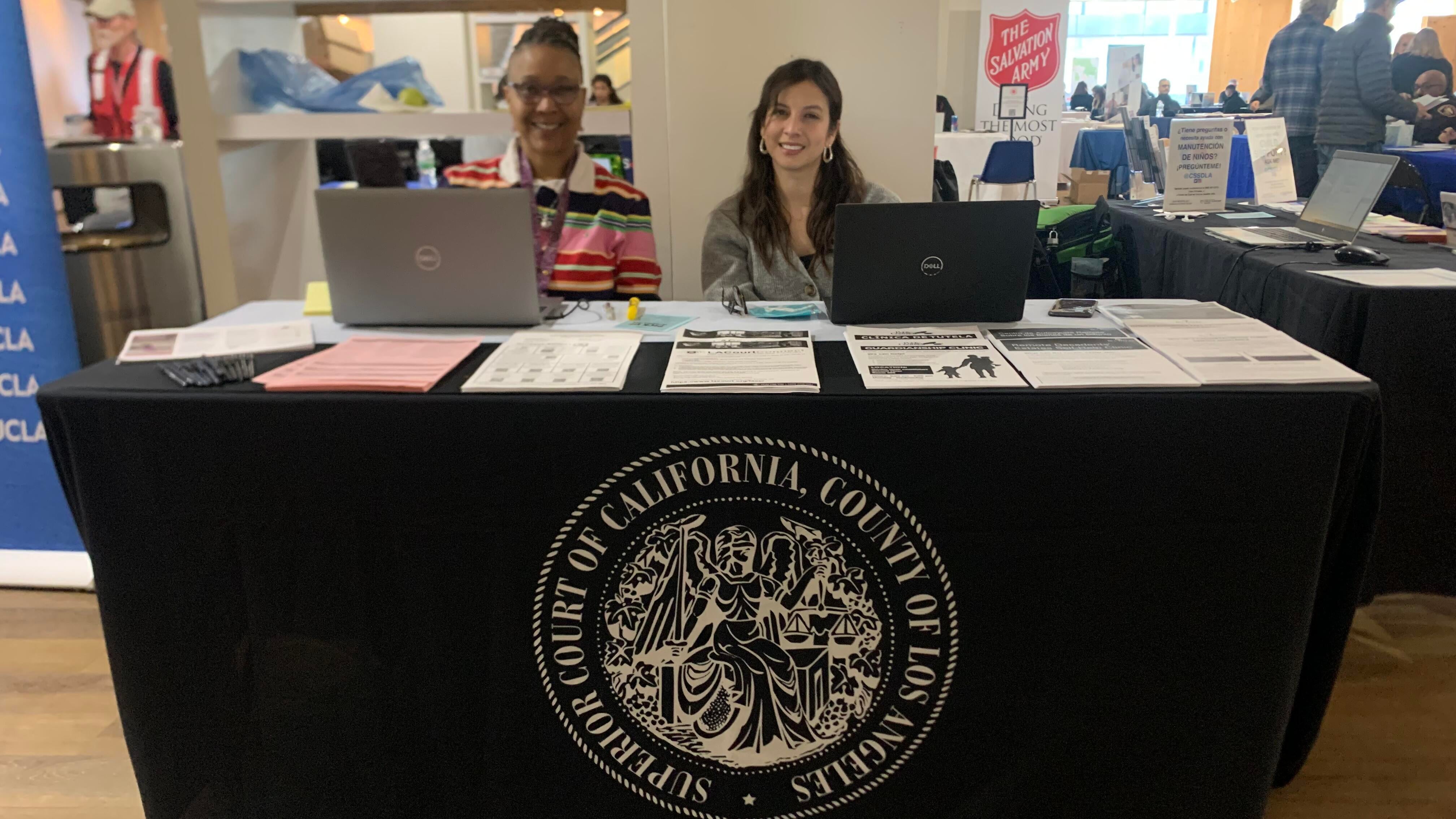 two people at information table