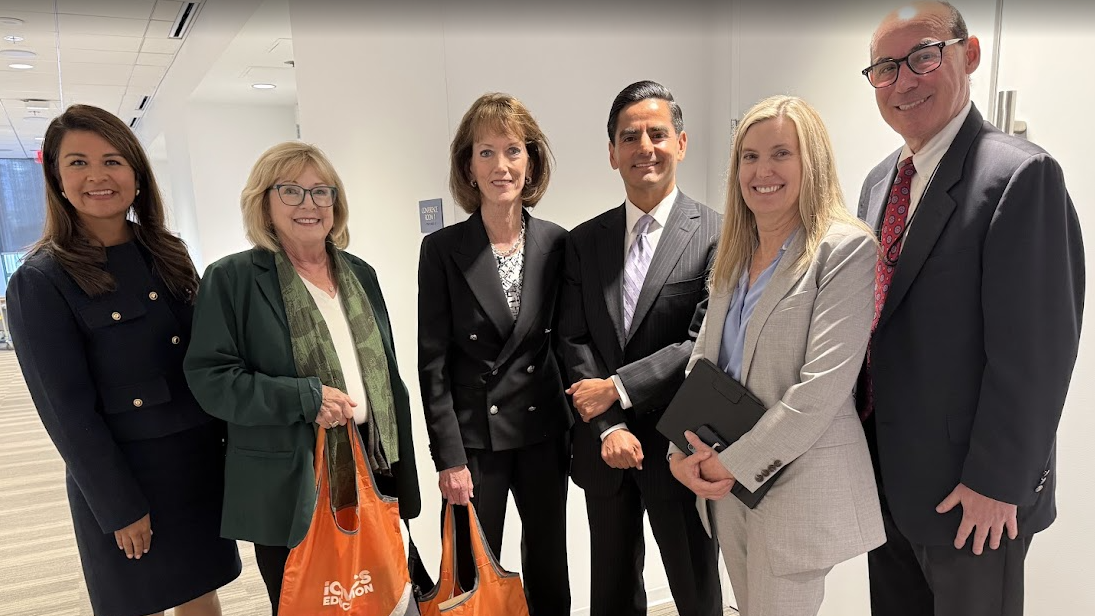 six judges standing in hallway with iCivics bags