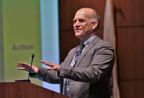 San Bernardino County Judge Kyle Brodie stands at a podium