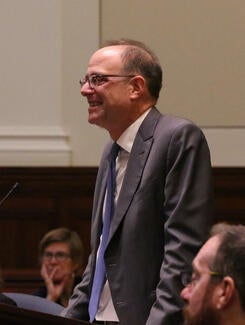 Justice Daniel Bromberg in formal attire at COJA hearing