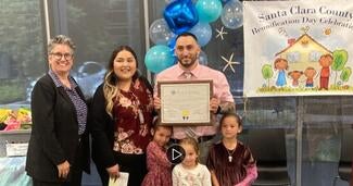 Judge stands with family at Family Reunification Day in Santa Clara County