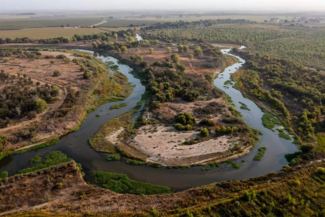 aerial view of river snaking through central valley 