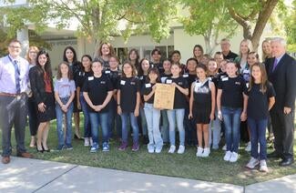 group of students standing outside with district reps and chief justice 