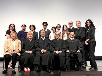 Members of the Fourth District Court of Appeal in the front row with students and staff in the back row.