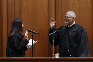 Justice Charles Smiley taking the oath of office.