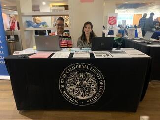 two people at information table