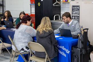 litigants and court staff at table