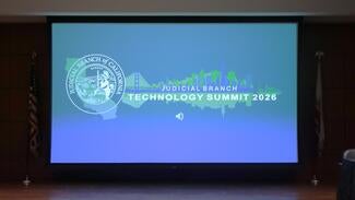 Graphic projected onto wall that reads "Judicial Branch Technology Summit 2026"