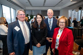 From left to right stands Executive Director of the California Access to Justice Commission Jack Londen, California Chief Justice Patricia Guerrero, and California State Senators Tom Umberg and Maria Elena Durazo. 