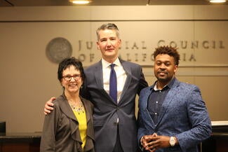 Judge Michael Begert (center), coordinator Allyson West (left), and Army veteran Darian Evans presented to the council on San Francisco&#39;s Veterans Justice Court.