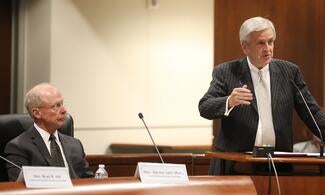 Justice Brad Hill (right) explains how public comment helped his committee finalize the priority list for new courthouse construction projects. Judge Steven Jahr (Ret.) (left) later took the council through the reprioritization process.